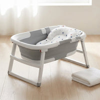 Baby Bathtub with Stand, 2-In-1 Collapsible Bath Tubs for Newborn to Toddler, Infant Bathtub with Folding Stand, Portable Bathtub for Baby Including Soft Cushion, Storage Pad (Gray) — Studio Shot